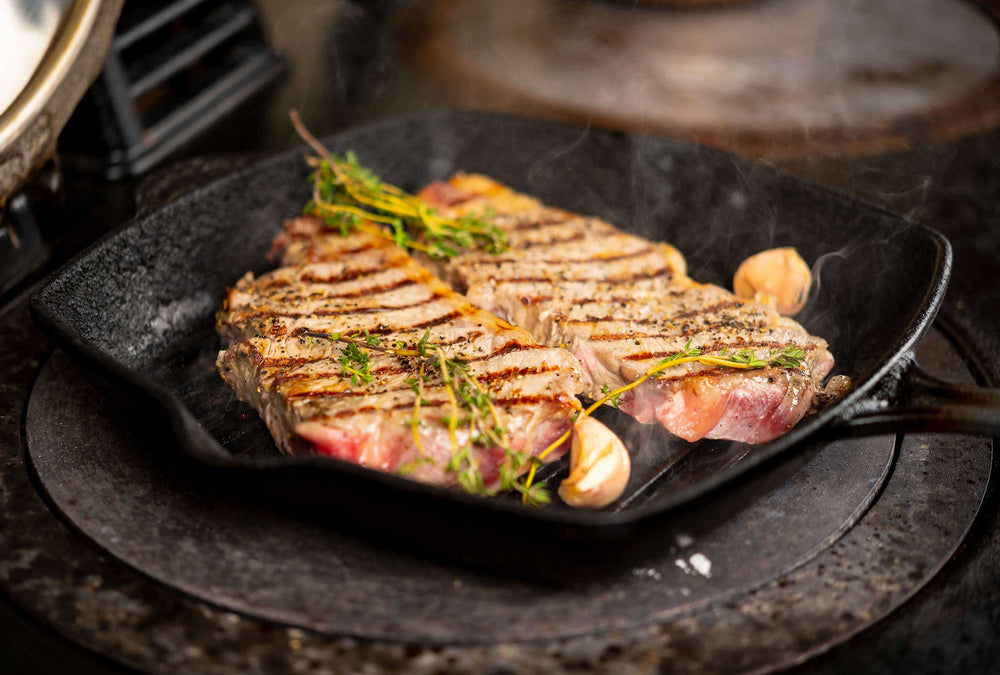 Three Men Butchers Behind Shop Counter In Black and White
